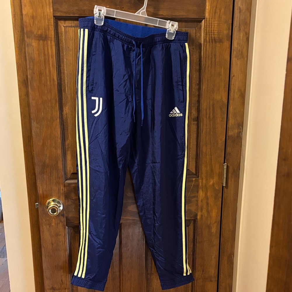 Adidas men’s Blue Joggers with Yellow Stripes